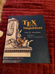 TeX for the Impatient book cover. Featuring a rabbit in a coat and carrying an umbrella reclining on some kind of shelf while checking a pocket watch.