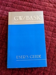 G/W Basic User's Guide book cover. Top with title is grey with white text, bottom with subtitle is blue with gray text