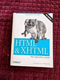 HTML & XHTML The Definitive Guide book cover from O'Reilly. Features a koala walking across the logo 