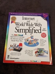 Cover of the Internet and World Wide Web Simplified book. Promotes the features of the book including color on every page and three images of an anthropomorphic floppy disk enjoying activities on the World Wide Web