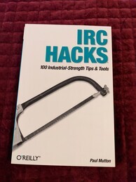 IRC Hacks book cover from O'Reilly. Features an image of a hacksaw
