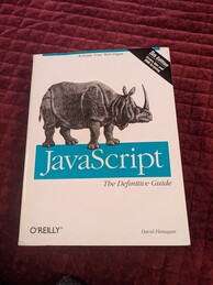 Cover of the JavaScript The Definitive Guide book from O'Reilly Media. Fifth Edition. Features an image of a Javan rhinoceros