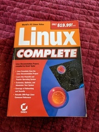 Linux Complete book cover. Features an image of the inside of a blue box where red spheres are traveling toward what looks like outer space with a small blue planet just visible in the corner.