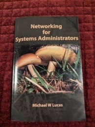 Networking for System Administrators cover. The cover is mostly green and it has an image of mushrooms on it