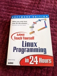 Teach Yourself Linux Programmming in 24 hours book cover. Features the title of the book in various fonts and an image of a stylized clock in the upper-right.