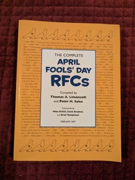 The Complete April Fools' Day RFCs book cover. The title is in a white panel over a yellow background. The yellow background has text of some of the RFC's within. There are sillhouettes of pigeons across the top and bottom with either a 0 or a 1 superimposed on each of them. Probably a reference to RFC 1149