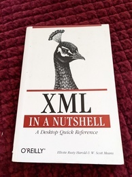 Cover of the XML in a Nutshell O'Reilly book. Features an image of the head of a peacock