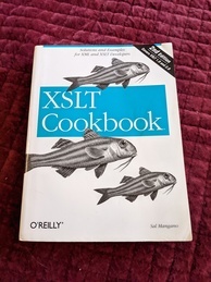 Cover of the XSLT Cookbook O'Reilly book. Features an image of redmullett fish swimming around the logo and a banner announcing the 2nd edition in the upper-right corner.