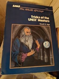Tricks of the UNIX Masters book cover. Featuring a painting of a wizard standing in the hallway of something that looks like a cathedral and performing some kind of feat that involves a swirling blue and white object