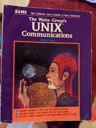Unix Communications book cover. Featuring a drawing of a large head of a man with a white beard and a red skull cap examining the much smaller earth while a disembodied hand reaches up toward the planet. There's also a large yellow circle with circuitry on it.