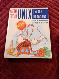UNIX for the Impatient second edition book cover. Features a rabbit laying on a platform balancing a ball on its feet that reads 'UNIX' juggling several carrots that have names of UNIX utilities printed on them. There is a pile of carrots on the ground and a pile of juggling clubs with the names of other utilities printed on them