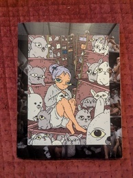 9front Dash One Manual. Features and image of a cartoon character with purple hair sitting in front of a shelf. The character is stroking a rabbit that is in their lap and they are looking toward the viewer with a neutral expression. The character is sitting in front of a shelf that has a variety of rabbits, also looking at the viewer. There are many such shelves in the background. The cartoon is centered over an image of an overcrowded prison