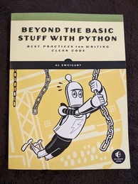 Beyond the Basic Stuff With Python book cover. Featuring a robot swinging on chains like he's doing American Ninja Warrior