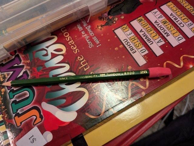 Tombow 8900 pencil with a cheap pink cap eraser on the end. It looks like it's wearing a little hat.
